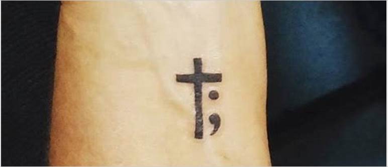 Semicolon with cross tattoo